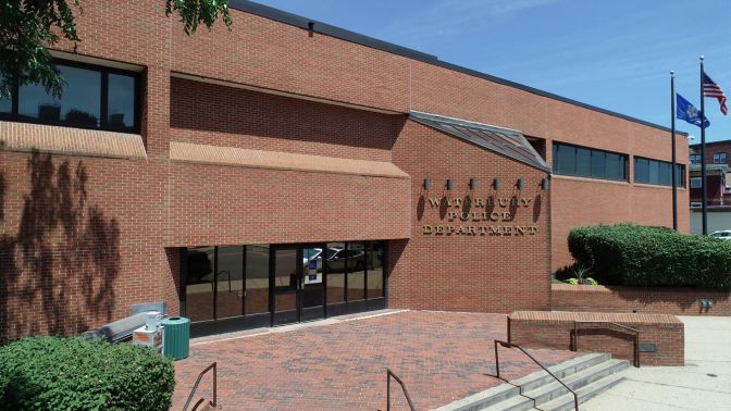 The brick exterior and main entrance of the Waterbury Police Department headquarters building